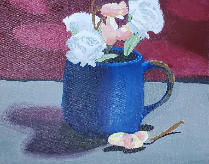 Blue mug painting with flowers completed by high school student. 