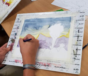A student making a painting 
