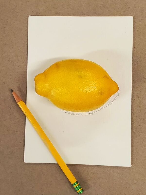 Lemon being traced by pencil